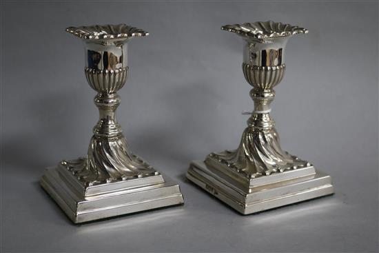 A pair of late Victorian silver dwarf candlesticks by Walker & Hall, Sheffield, 1898, 12cm.